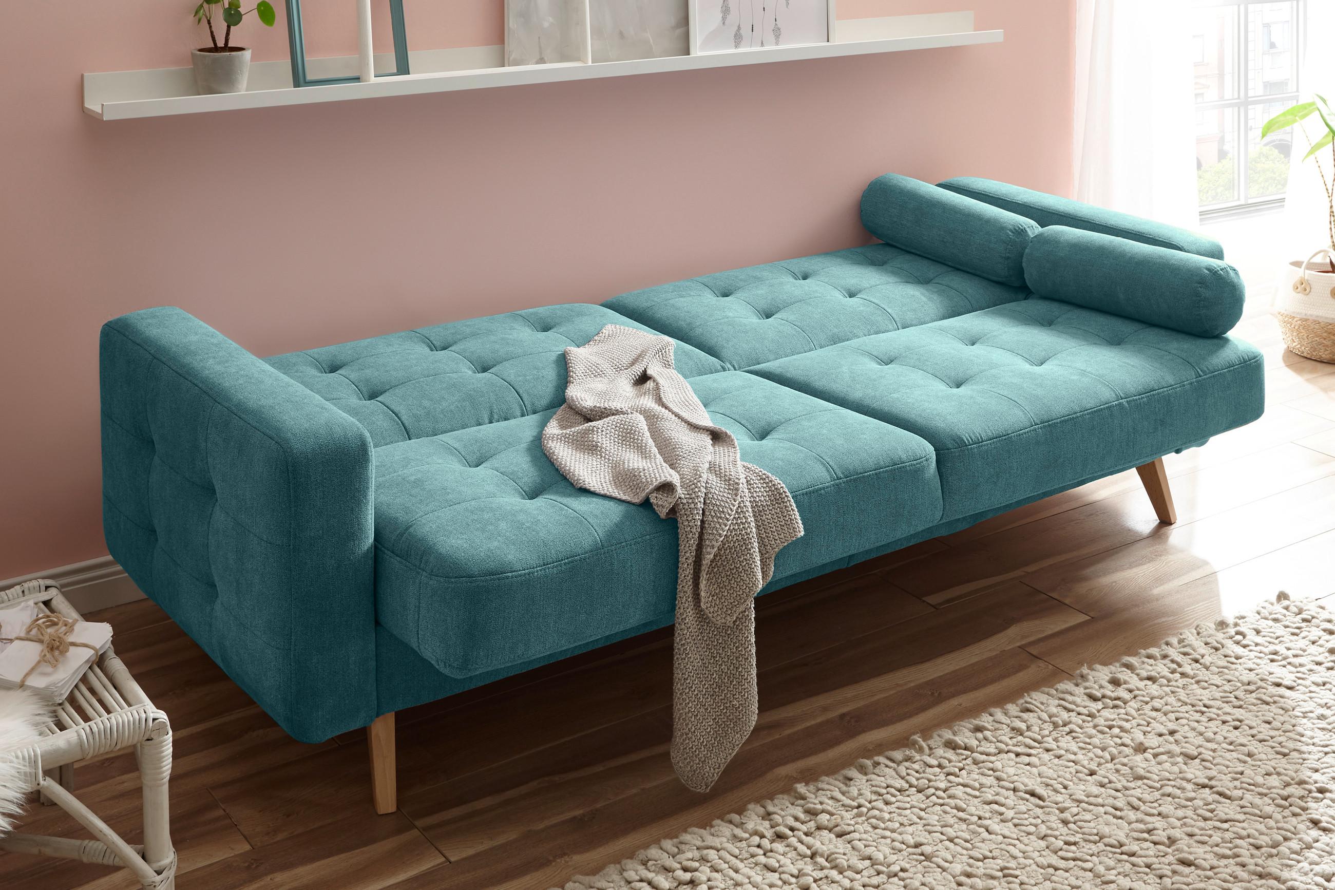 Grünes Klappsofa mit Bettkasten