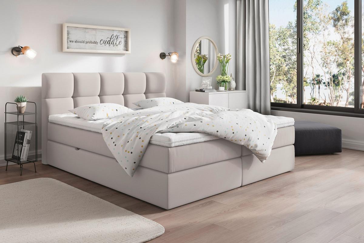 Hellgraues Boxspringbett mit Matratze und durchgehendem Topper