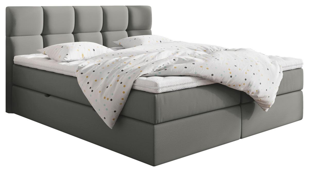 Boxspringbett mit grauem Bezug und gepolstertem Kopfteil