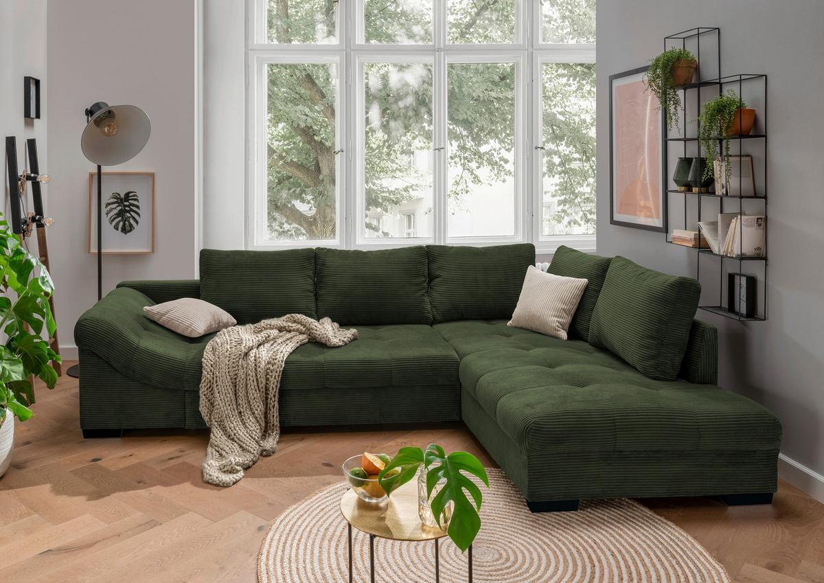 Modernes Ecksofa in Dunkelgrün mit weichem Cord-Bezug und Ottomane auf der rechten Seite