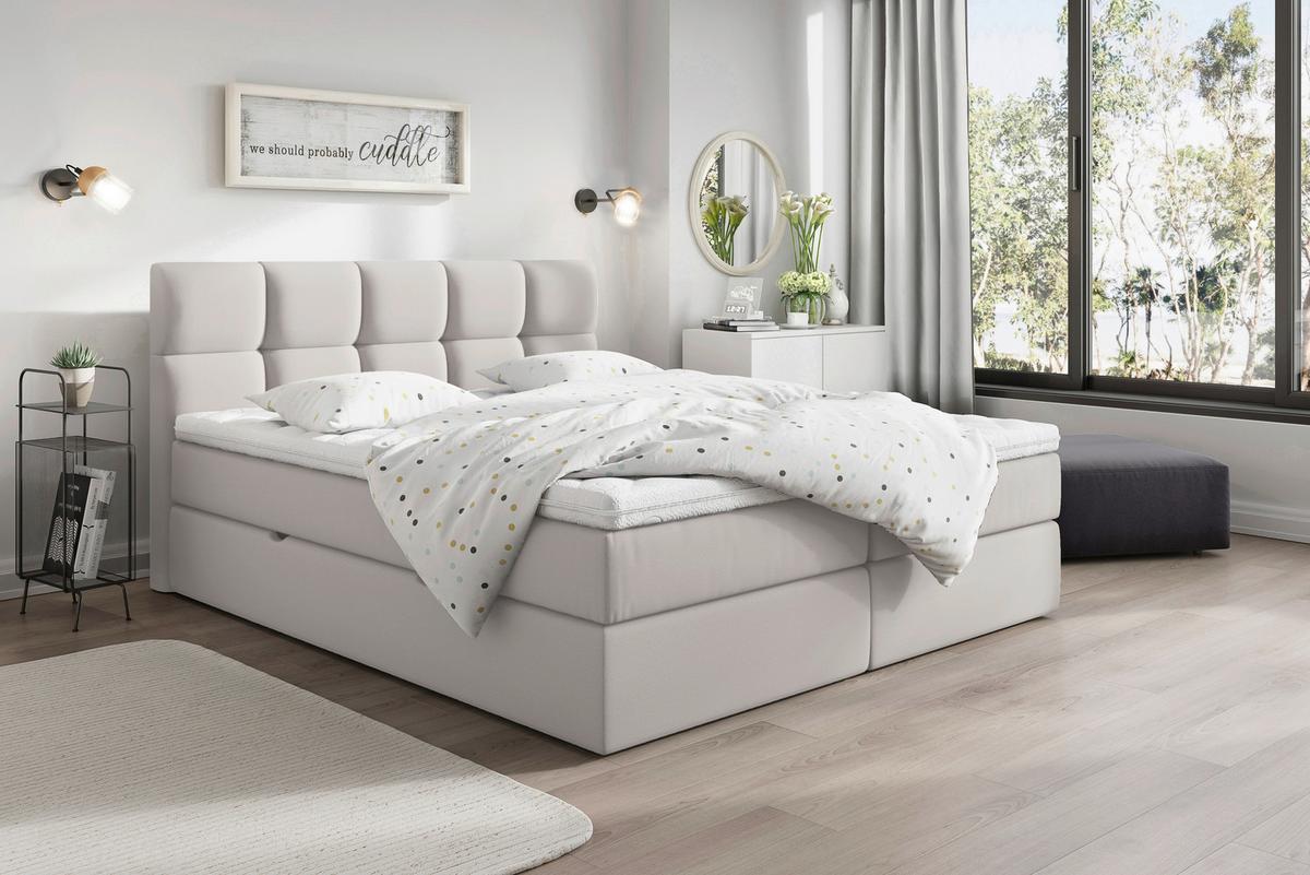 Hellgraues Boxspringbett mit Matratze und durchgehendem Topper