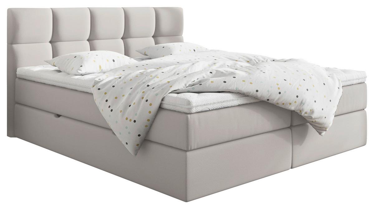 Boxspringbett mit hellgrauem Bezug und gepolstertem Kopfteil